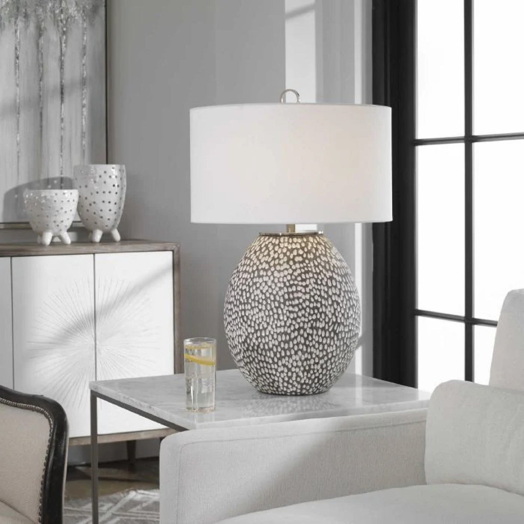 modern speckled gray white lamp in room setting with white chair