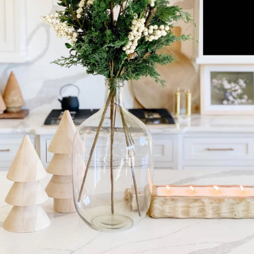 multi wick wooden candle on kitchen counter with other decor