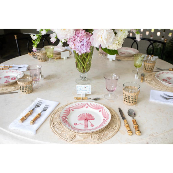 Elegant table setting with Abigails Casa Nuno Pink Palm Dinner Plates (set of 2) and bamboo cutlery.