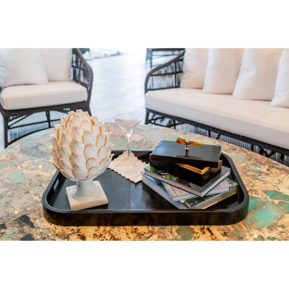 Abigails Artichoke Off White Ceramic Decor with tray, martini glass, box, and books on a marble table in seating area.