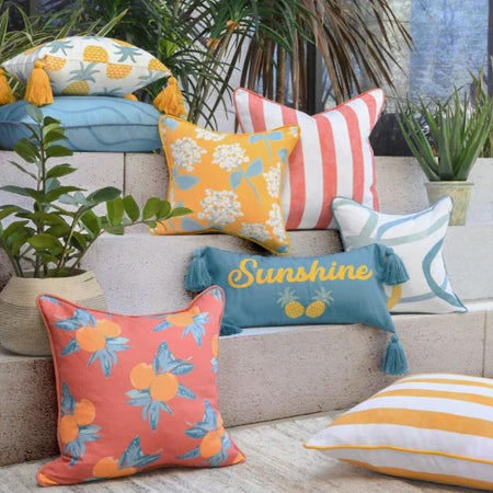 bright colorful outdoor pillows and poufs 