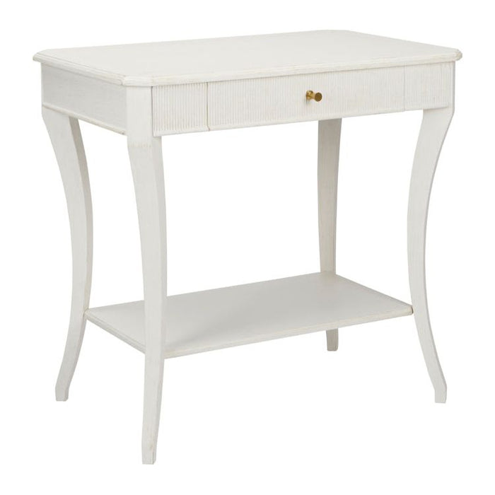 The Sanibel Console Table by Phillips Scott, available in a white finish, features polished brass hardware that complements its single drawer and lower shelf, adding a touch of traditional style.