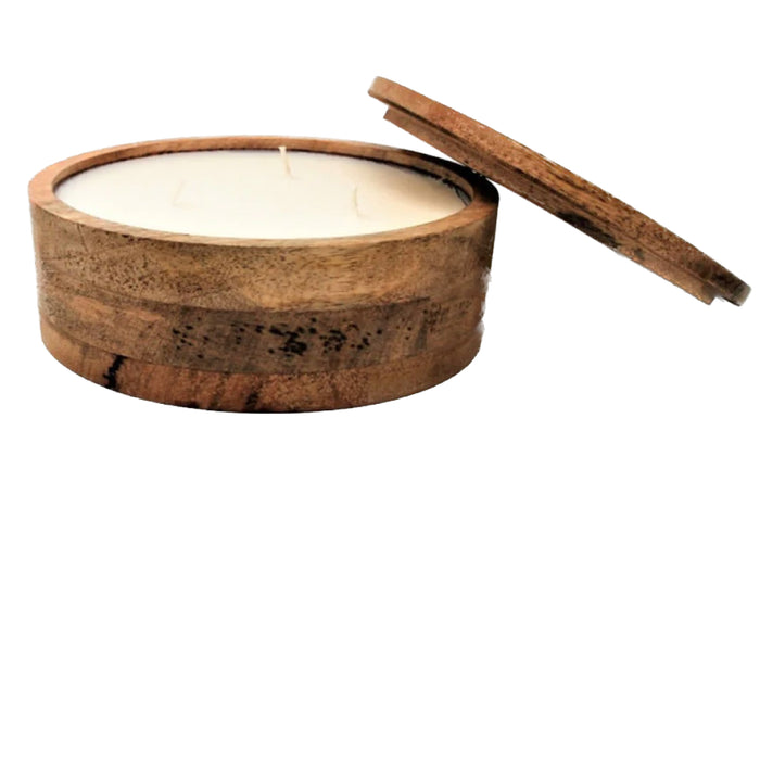 The Mountain Barrel Candle - Medium from Himalayan Trading Post is crafted in Georgia and features a hand-poured soy wax blend with three wicks, housed in a wooden container made of renewable mango wood with a partially open lid.