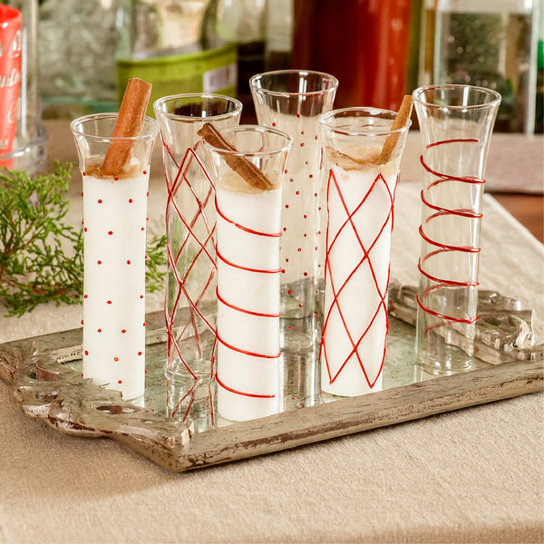Six Abigails Razzle Dazzle Red Icon Champagne Flutes with creamy drinks and cinnamon sticks on a silver tray.