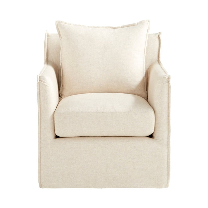 cream slipcovered swivel arm chair
