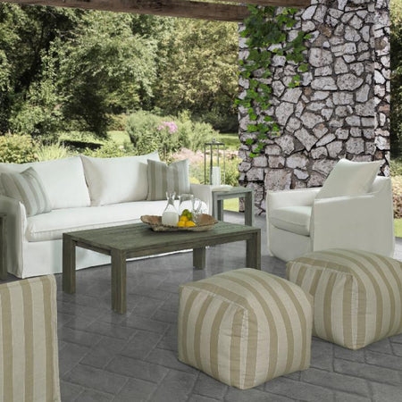 outdoor white sofa and chair with wood coffee table and striped poufs