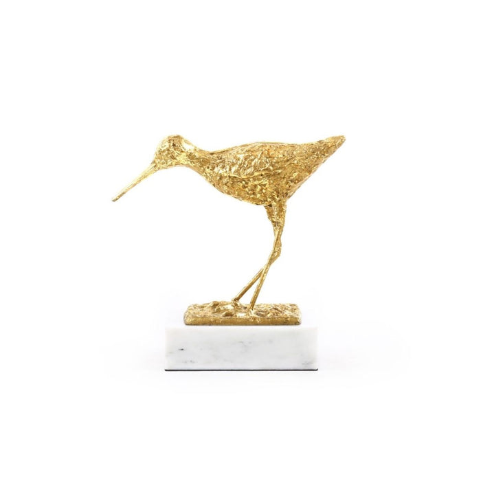 white marble base gold sculpture sandpiper bird