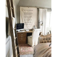 Home office with wooden desk, computer, and decorative elements.