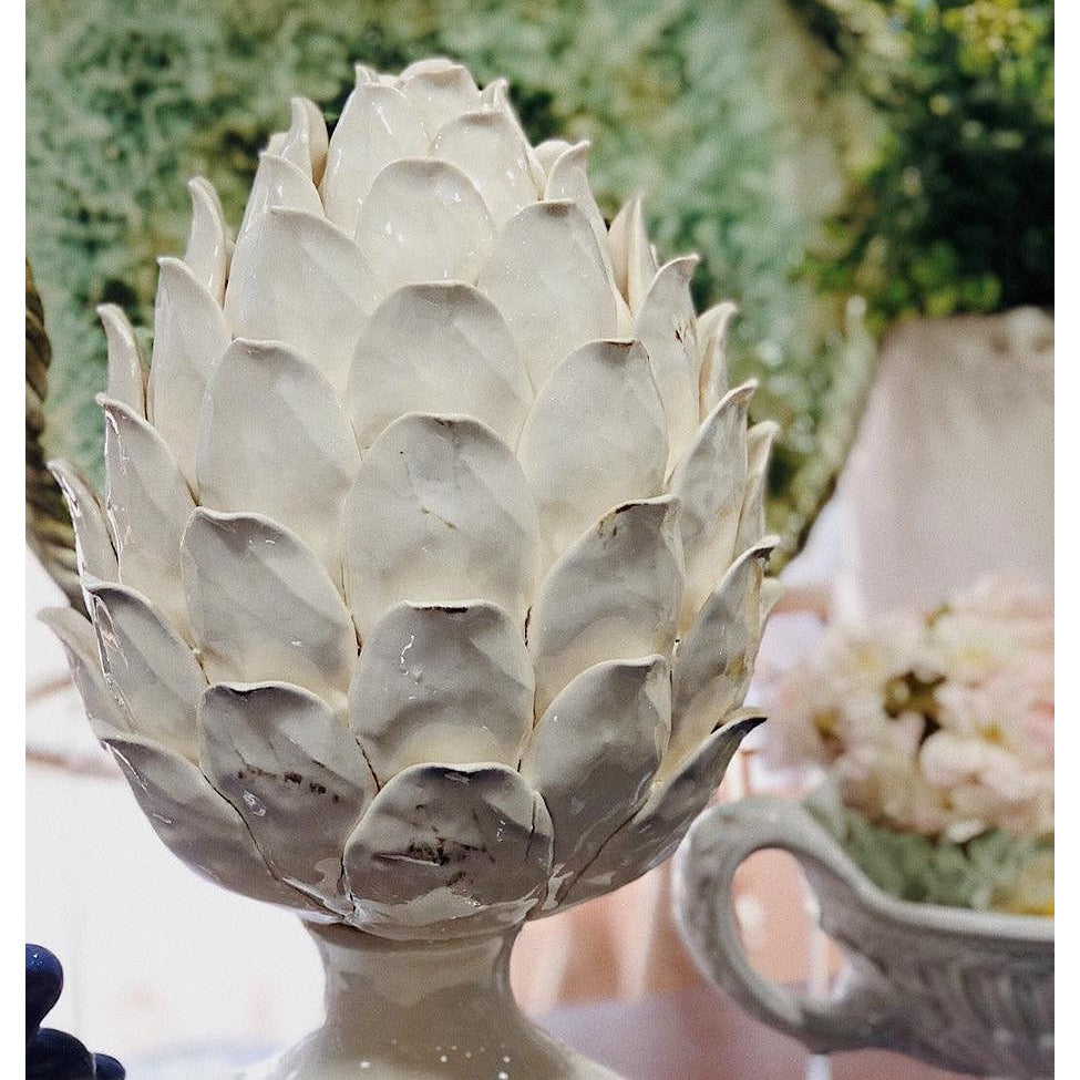 white ceramic pedestal artichoke