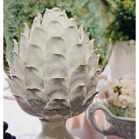 white ceramic pedestal artichoke