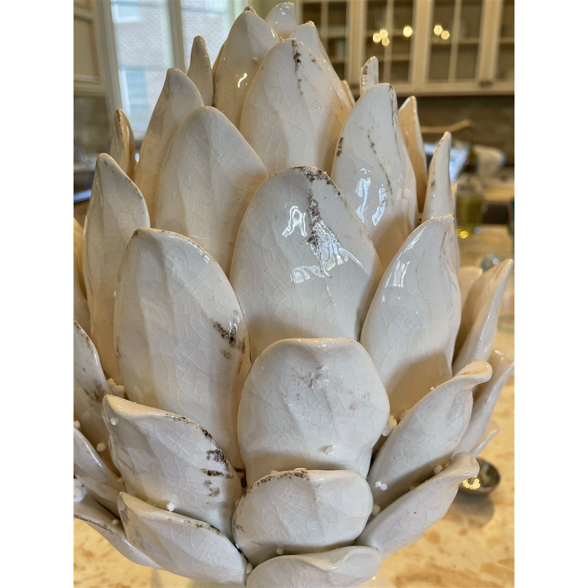 white ceramic pedestal artichoke
