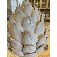 white ceramic pedestal artichoke