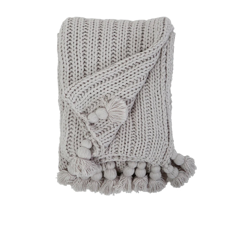 grey knitted throw tassels