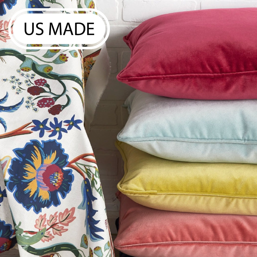selection of green and yellow pillows on a wooden bench 