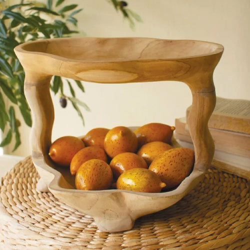 Round mirror with a wooden squiggle frame on a dark wall