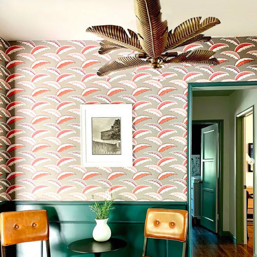 red floral wallpaper in traditional bathroom with gold bamboo light fixture