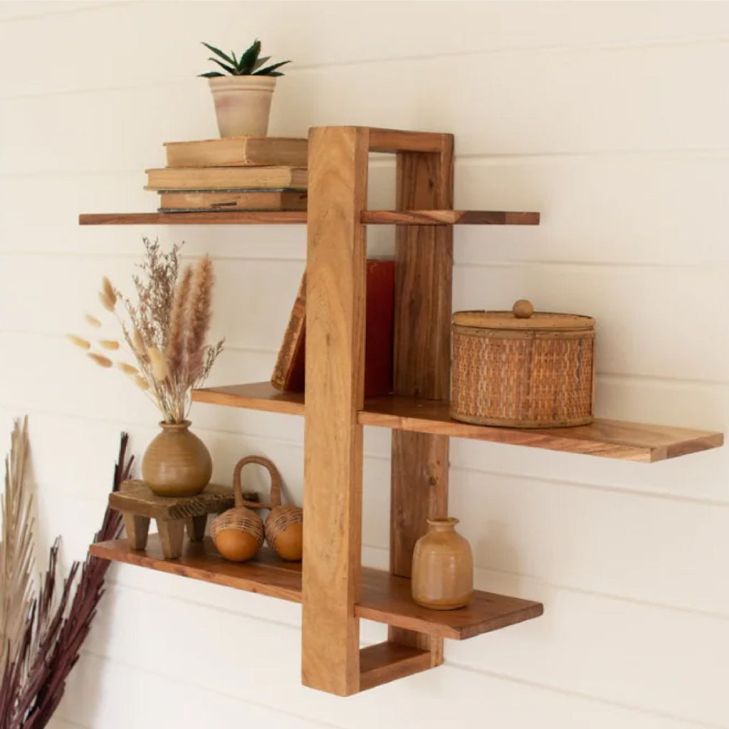 Metal and wood wall shelf with rattan magazine rack on a wall