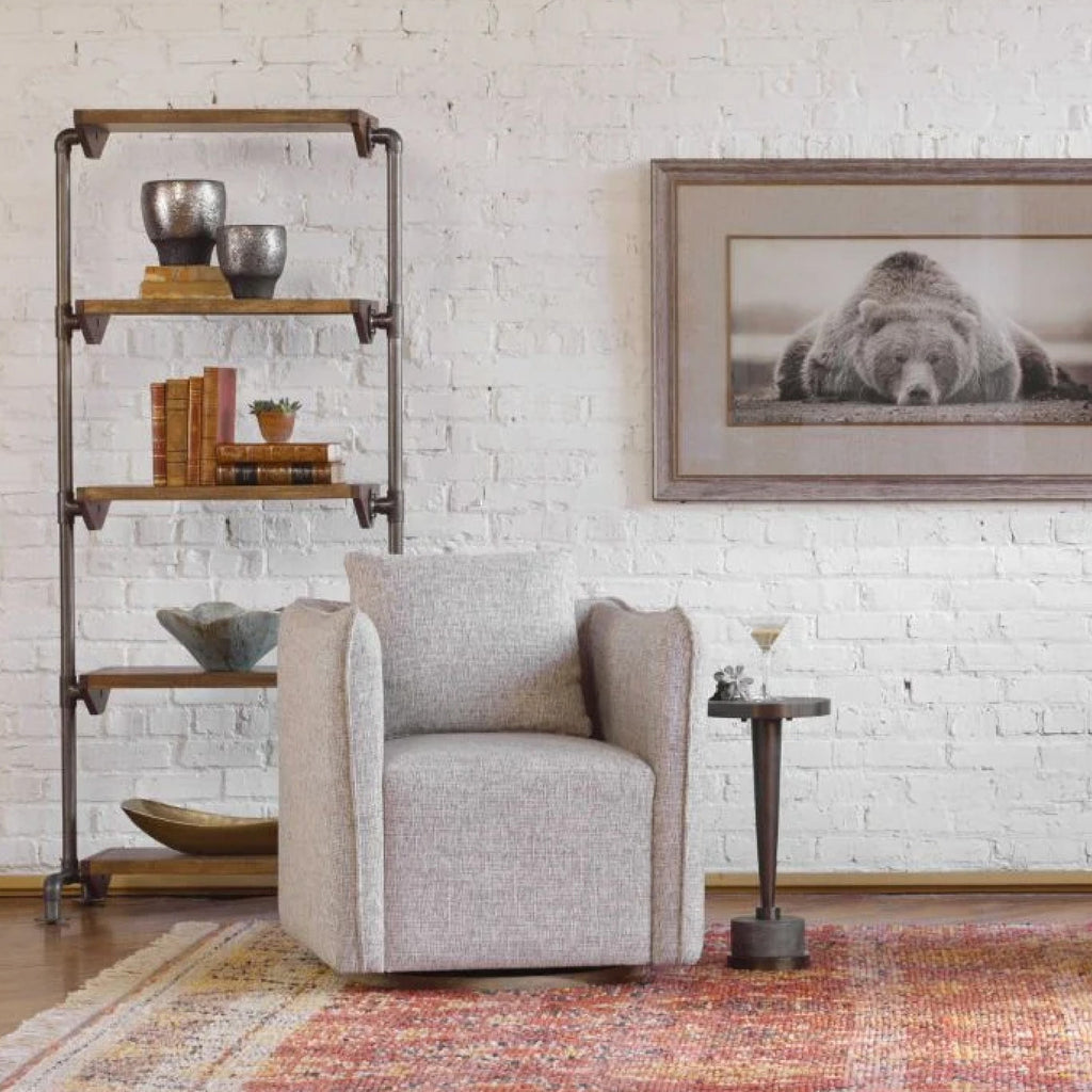 Farmhouse style bed with a wooden headboard and metal wall sconce