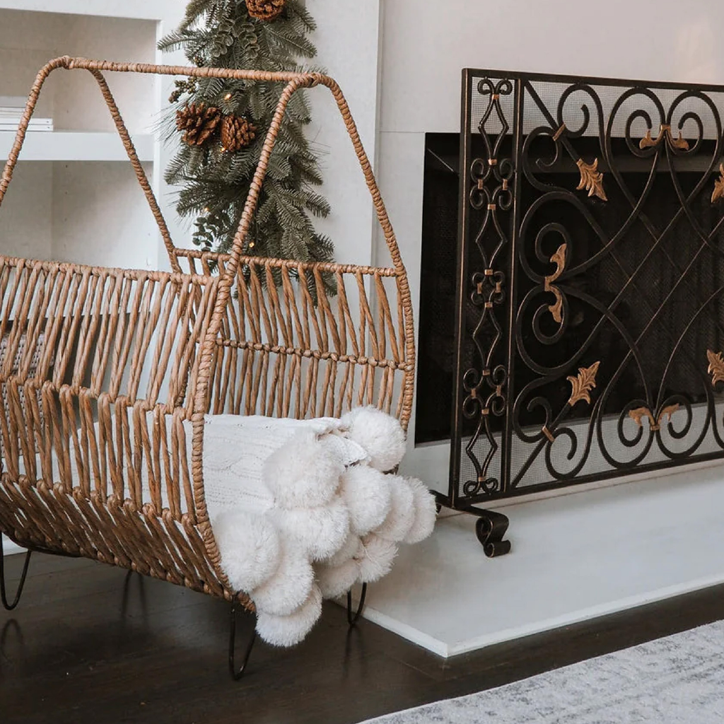 black and gold finish fireplace screen with rattan throw blanket basket 