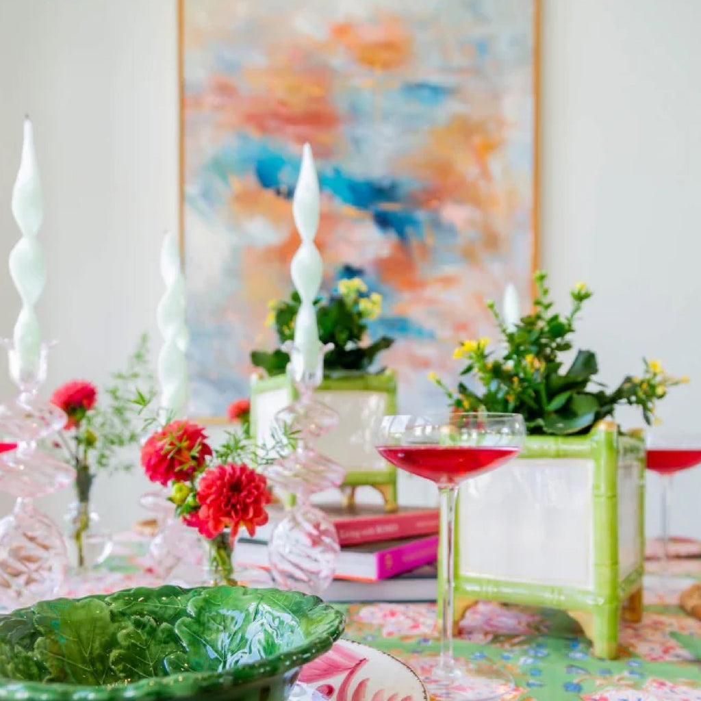 white melamine scalloped plates with linen napkin on a table