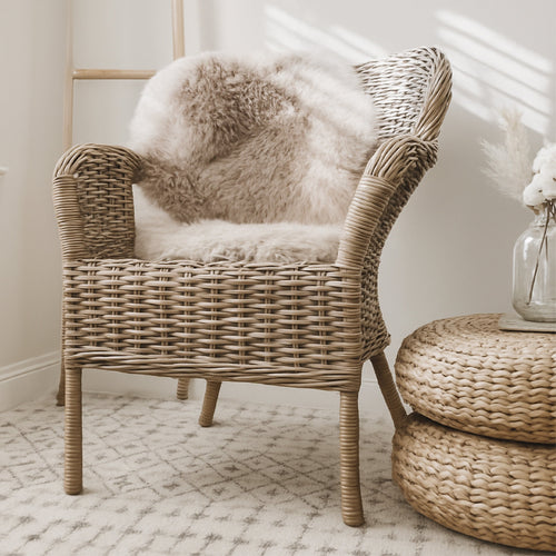 Warm taupe pelt thrown over a wicker chair