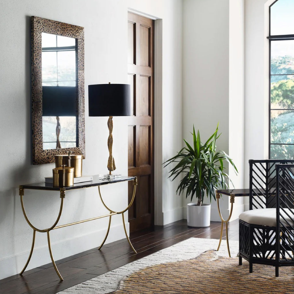 Stylish black & white home entryway with mirror and bench