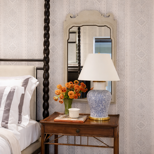 white mirror above nightstand with lamp and decor from Mirror Home