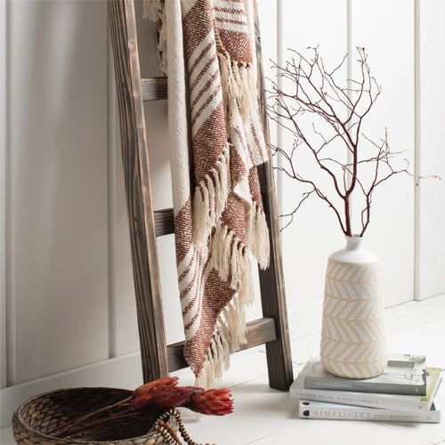 Two rectangular ceramic jars with marble-like blue, green, and white patterns beside frosted glass beads.