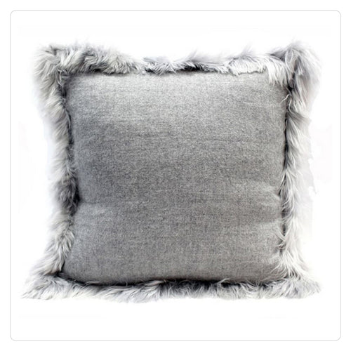 grey throw pillow with faux fur trim 