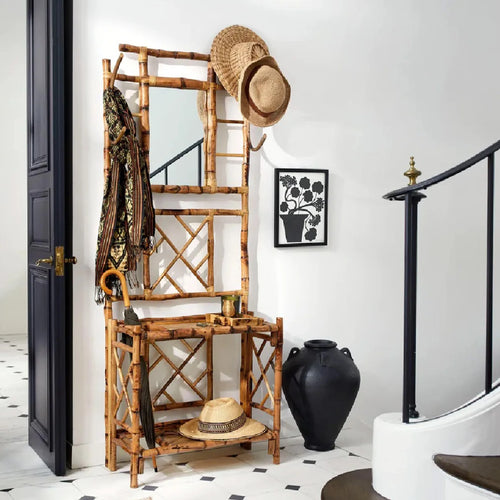 Tortoise shell hall tree in an entryway with stairs