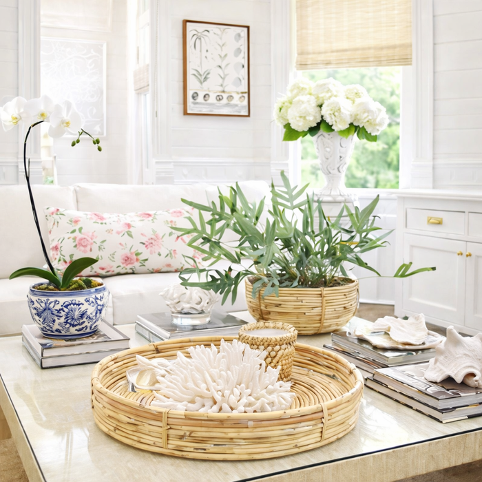 wicker tray and bowl on coffee table in a spring inspired living room