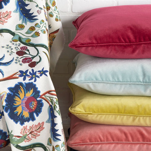 primary color pillows on white outdoor couch