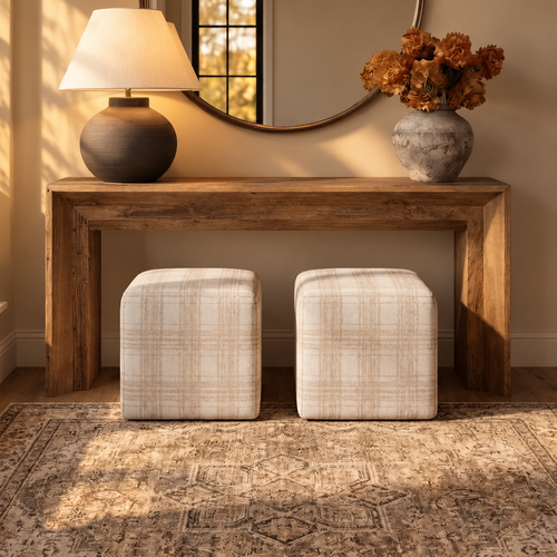White, textured wall sculptures resembling coral paired with decorative seashell stands on a table.
