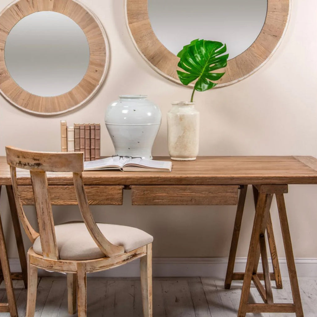 Reclaimed wood desk and chair with decor and mirrors on the wall