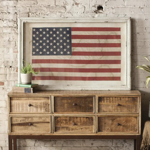 american flag art and wooden console 