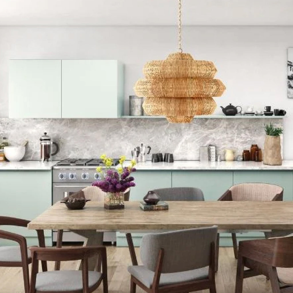 grass cloth chandelier over mid century modern dining table and blue kitchen 