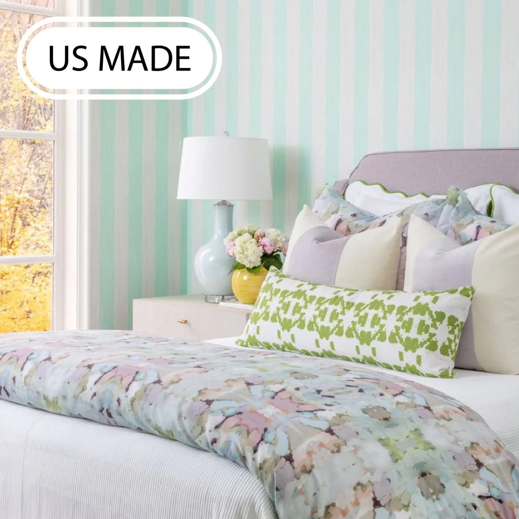 Pink and white bedroom with Laura Park bedding and pillows 