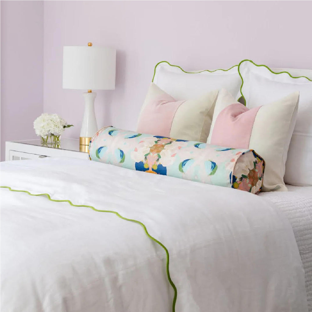 Pink and white bedroom with Laura Park bedding and pillows 