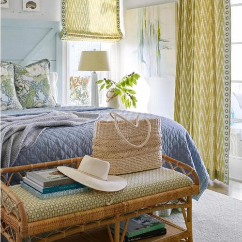 blue bedroom motif with bamboo bench and green window curtains