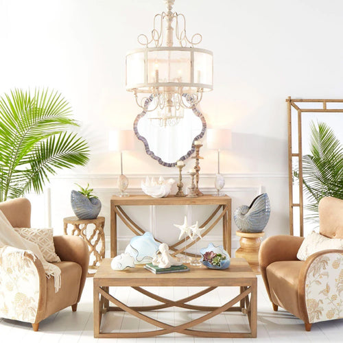 coastal living room with brown leather accent chairs and neutral accessories
