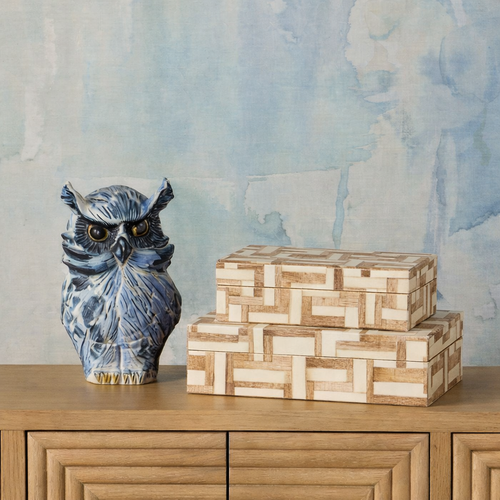 grass cloth chandelier over mid century modern dining table and blue kitchen 