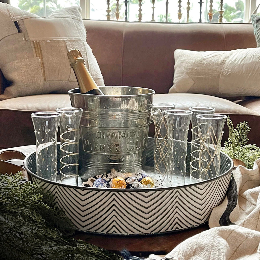 Champagne bucket and glass on coffee table tray