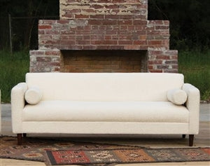 ivory boucle sofa with throw rugs 