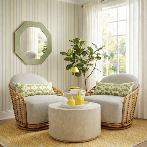sunroom in zesty greens and yellows with two rattan chairs