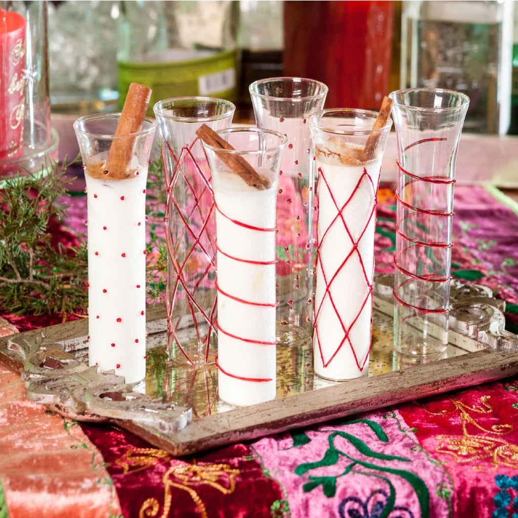 clear champagne flutes with red accents