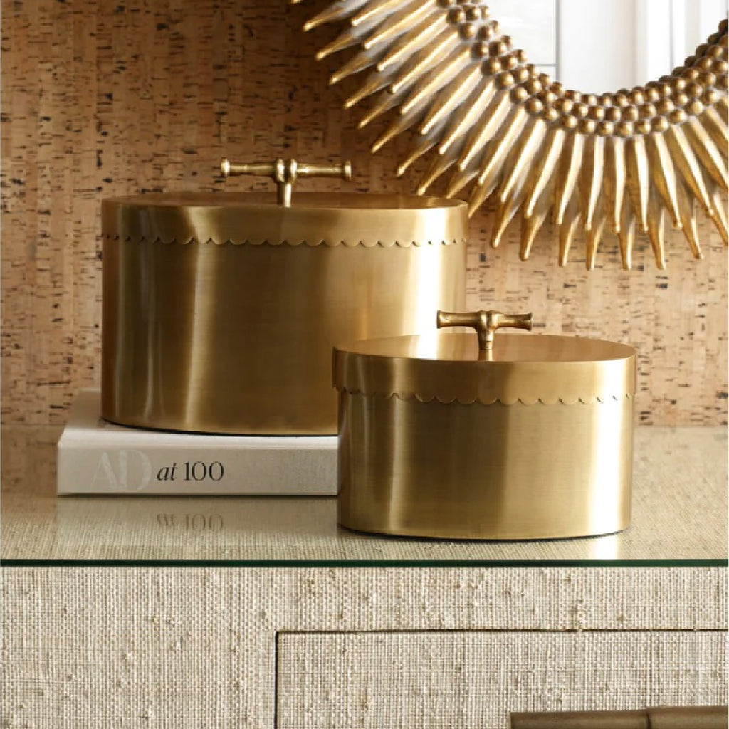 Two brass oval dcorative boxes by Wildwood Homeon a console table