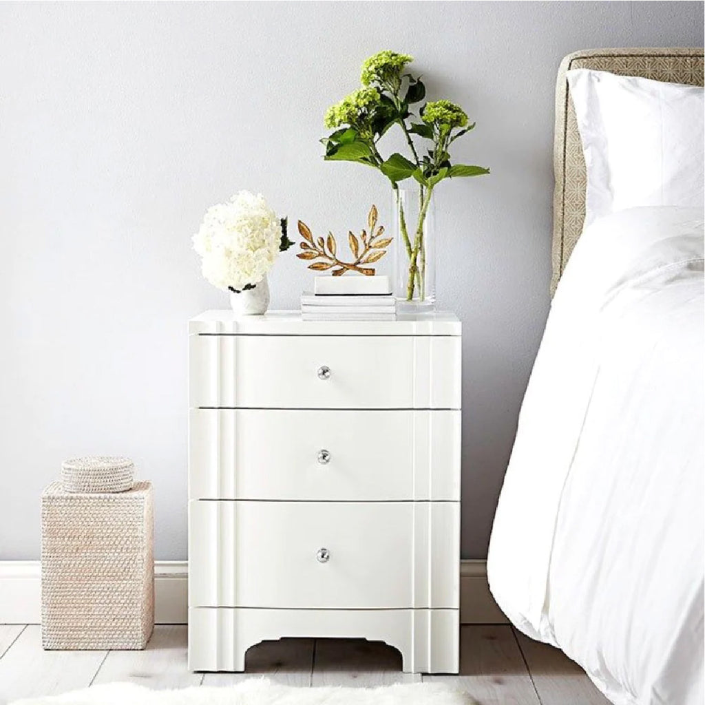 White bed side table with decor from Villa & House