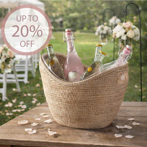 rattan wine bucket on table with bottles at wedding