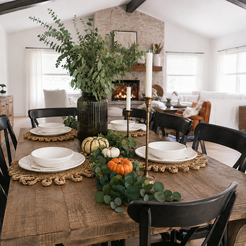 Table set for a Fall meal with a set of green and leaf pattern dishes