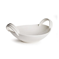 White ceramic serving bowl with handles on a white background